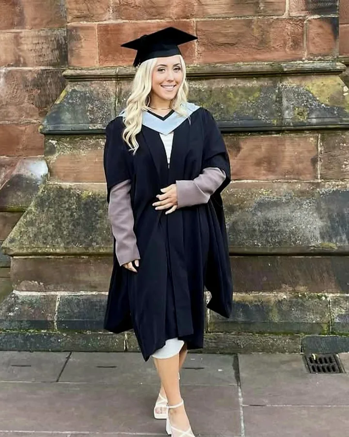 Amy Burton in a graduation gown and cap