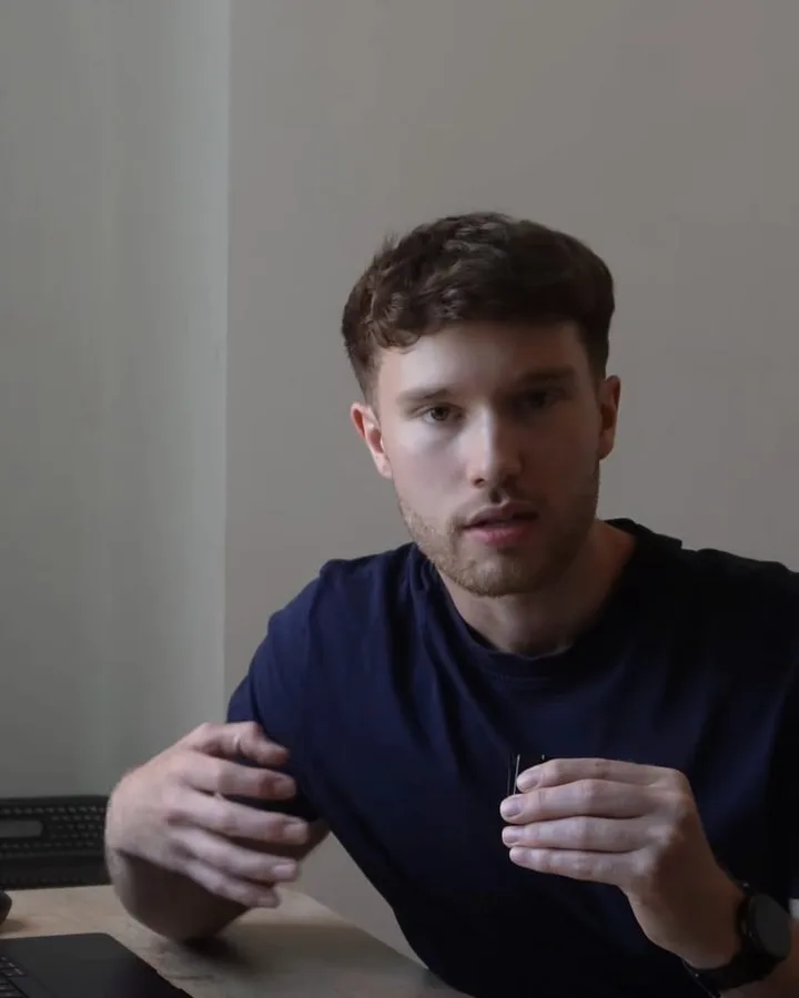 Joe McClean at a desk, talking to camera